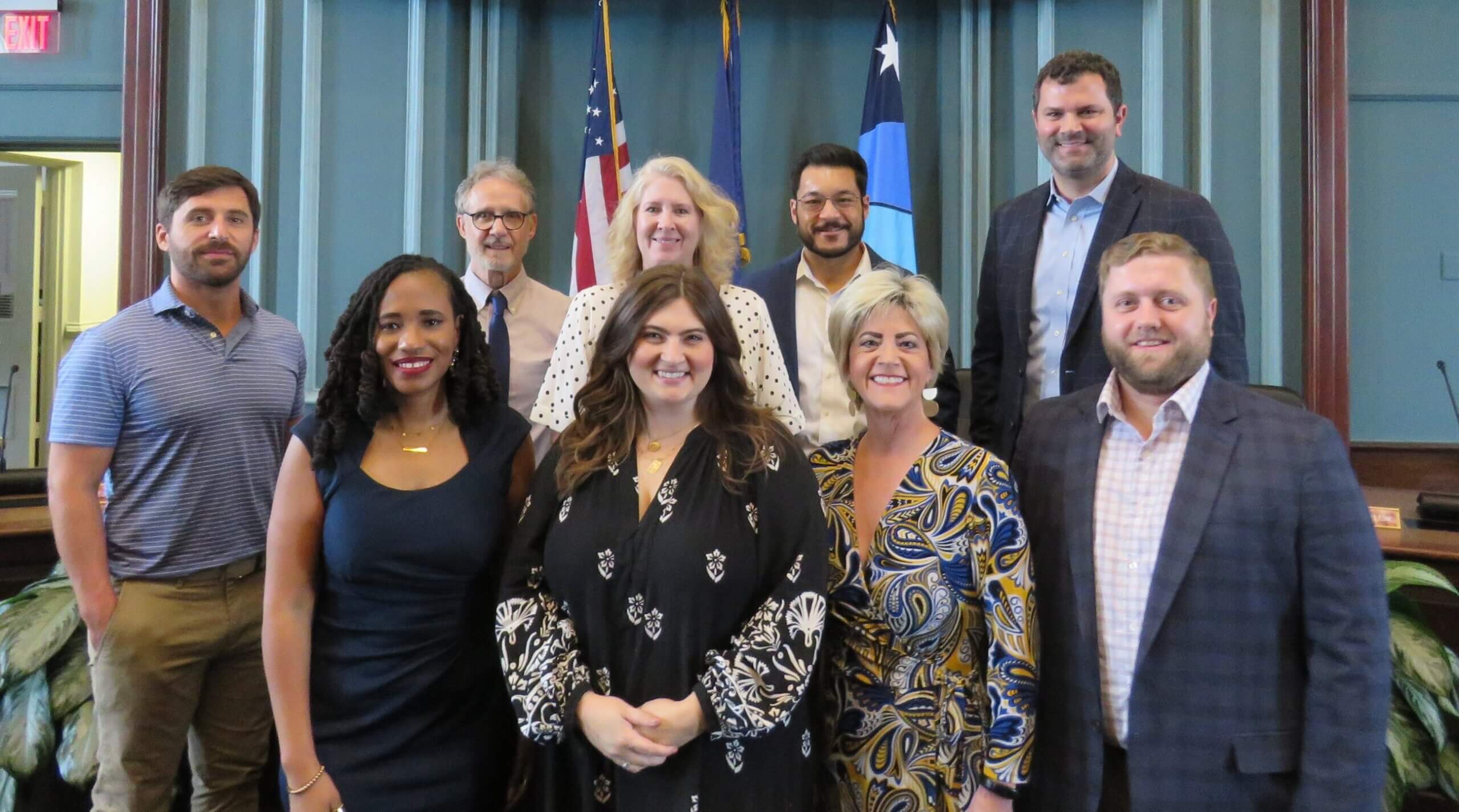 A photo of the current members of D/DRC standing in front of the dais in Council Chambers.