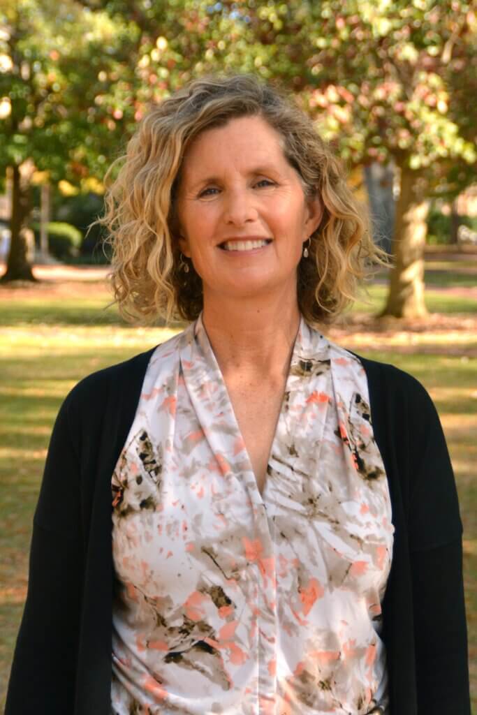 Photo of Coelette Gruber with the USC Horseshoe in the background